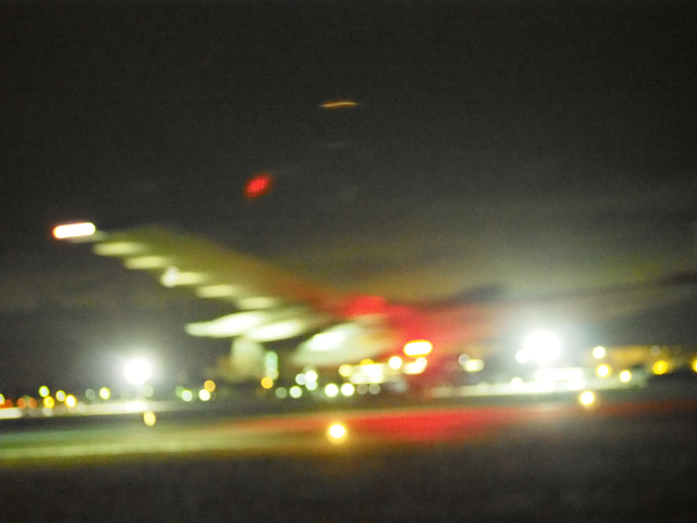 This is the best I could do for the Solar Impulse landing at Moffett Field. These pictures were shot at midnight, in the dark, with the camera adjusted to 26,000 ISO ...